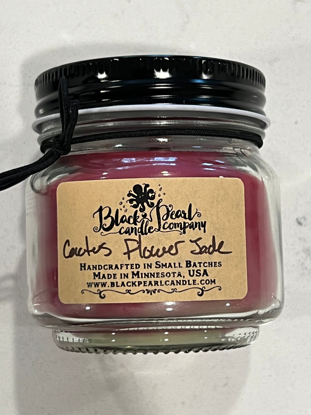 Cactus Flower & Jade scented candle in 8 oz mason jar with wood wick, soy-paraffin wax, and fresh green floral fragrance with aloe and agave notes