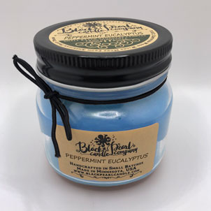 Peppermint Eucalyptus scented candle in 8 oz mason jar with wood wick, soy-paraffin blend, infused with essential oils for a crisp and calming spa scent