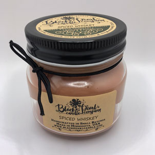 Spiced Whiskey scented candle in 8 oz mason jar with wood wick, soy-paraffin wax, and warm spiced bourbon and oak fragrance