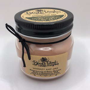 Whiskey & Oak scented candle in 8 oz mason jar with wood wick, soy-paraffin wax, and rich bourbon barrel fragrance with patchouli and oak